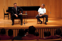 Peyton Manning on stage with Bill Lynch