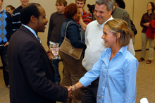 Paul Rusesabagina shaking hands with students