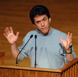 Mitch Albom with his hands up during the Ubben Lecture