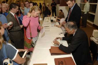 Ralph Nader talking with students at a book signing