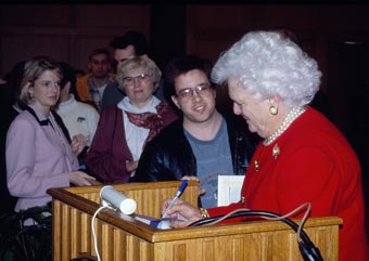 Barbara Bush signing books for students