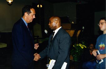 Bill Bradley shaking hands after the lecture