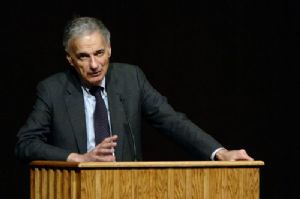 Ralph Nader speaking behind the lectern
