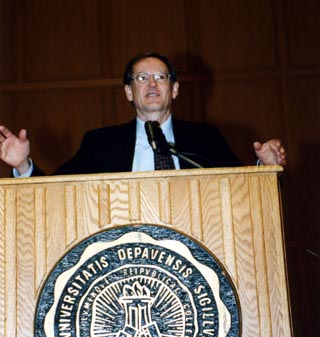 George Gilder behind a lectern during an Ubben Lecture
