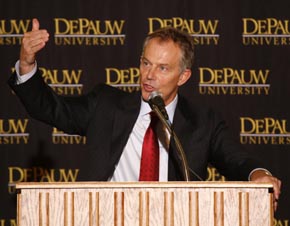 Tony Blair making a point with right arm raised