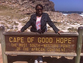 Clarissa Peterson behind Cape of Good Hope sign