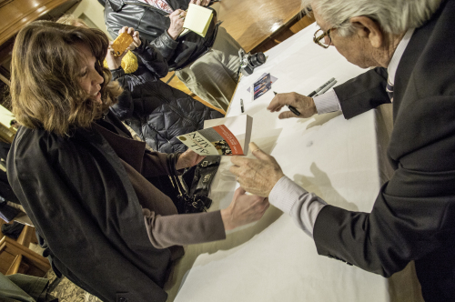 Carl Bernstean signing a book