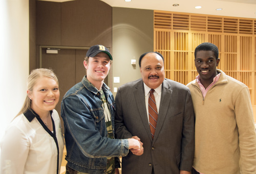 Martin Luther King III posing with students