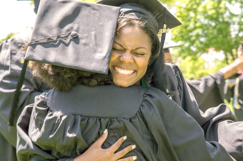 Students hugging after commencement