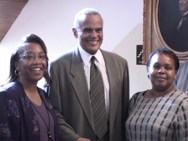 Harry Belafonte posing with students