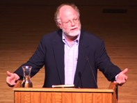 Ben Cohen speaking behind a lecturn during an Ubben Lecture