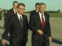 General Wesley K. Clark walking with Bob Bottoms at the airport