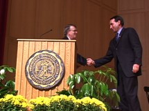 Mike Krzyzewski shaking hands with Bob Bottoms