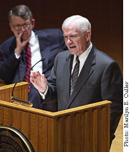 Robert Gates speaking to the crowd with Bob Bottoms looking on