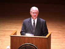 Robert Gates behind a lecturn during an Ubben Lecture