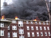 Black smoke and fire on the roof of Rector Hall