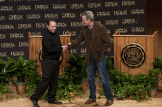 Jimmy Wales and Nicholas Carr shaking hands on stage